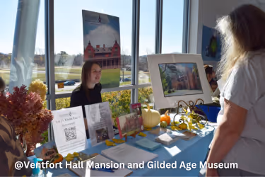 Planning Your Visit - Woman sitting at the welcome table