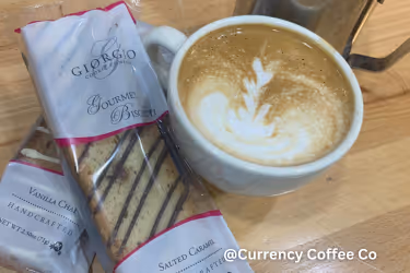 Currency Coffee with a gourmet biscotti