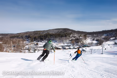 Two people skiing at Catamount Mountain Resort