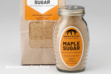 A glass jar of maple sugar stands beside a paper pouch of sugar from Justamere Tree Farm.