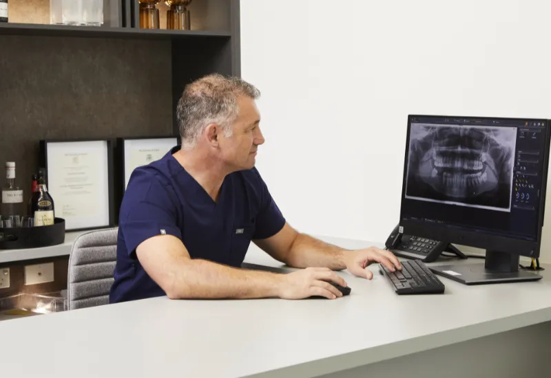 Dr Daniel Adamo planning dental implant treatment