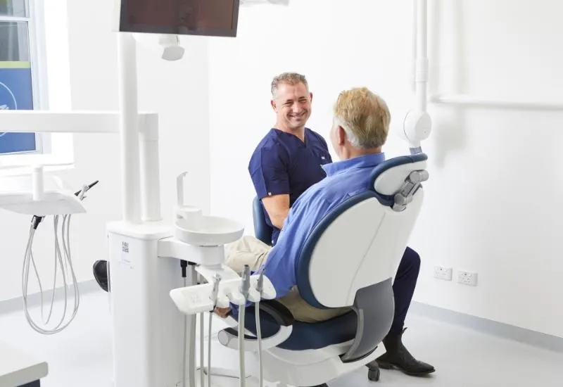 Dr Adamo discusses missing teeth replacement with his patient