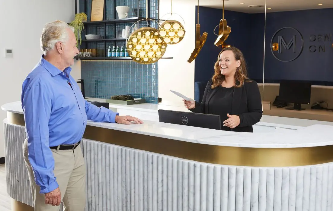 Patient is presented with payment options at Dental Implants on Miller.
