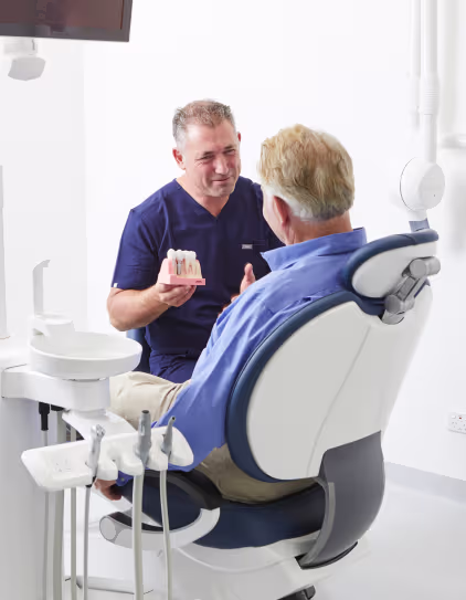 Dentist explaining dental implant options to patient in Sydney clinic