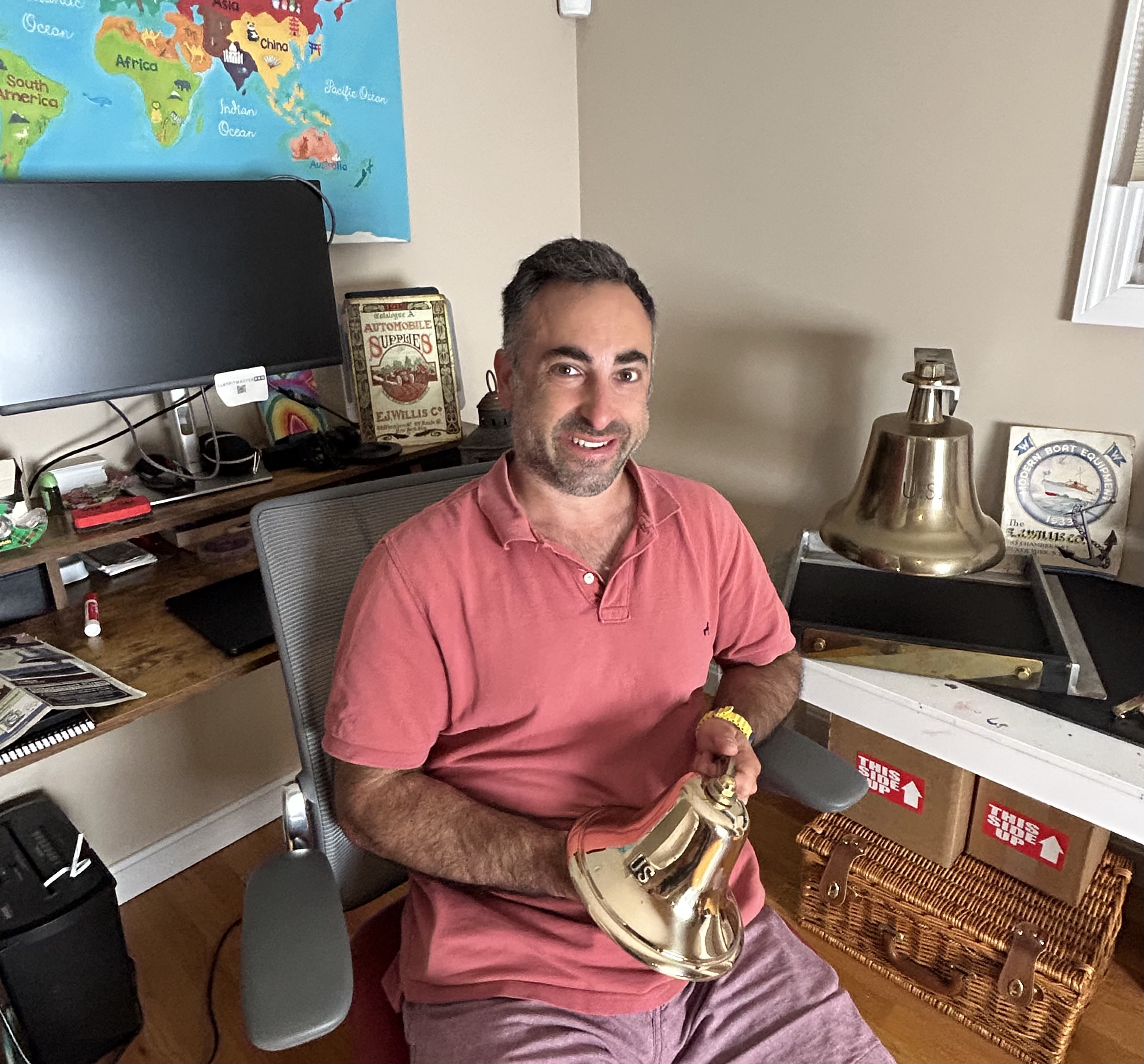 Jon at his office, surrounded by bells