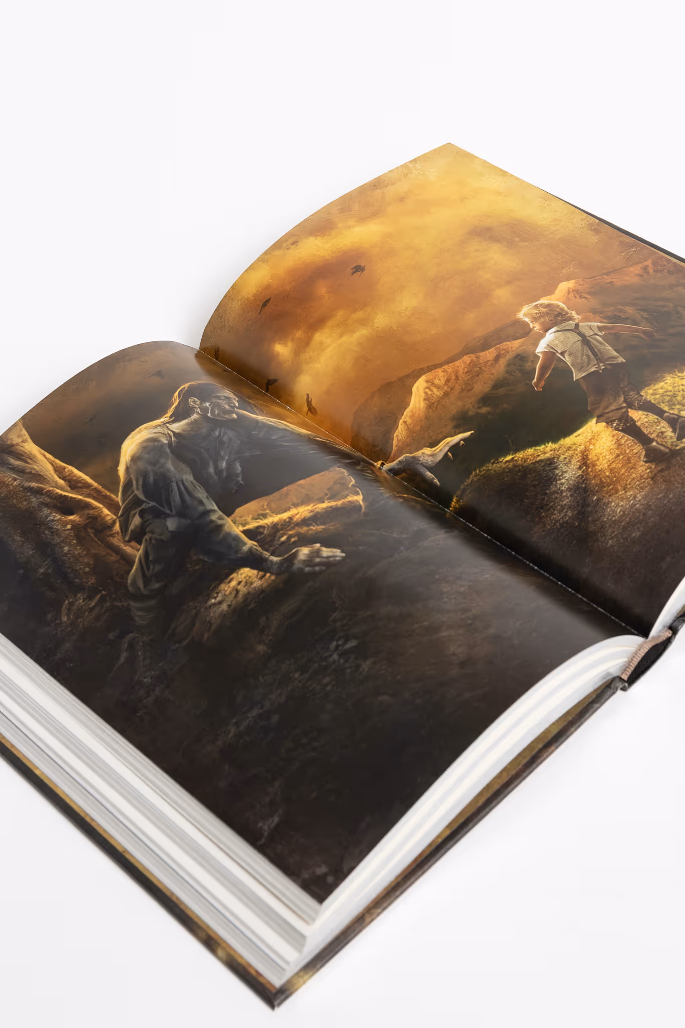Open spread of "Frankenstein book" showing artwork of a large, muscular creature reaching out toward a young child standing on a rock in a dramatic landscape with a golden sky.