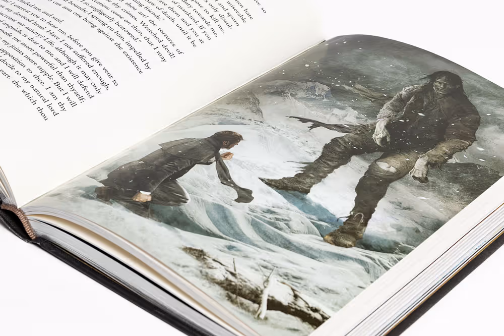 Spread of "Frankenstein" showing an illustration of a man kneeling on snowy ground facing a large, intimidating figure in rugged clothes.