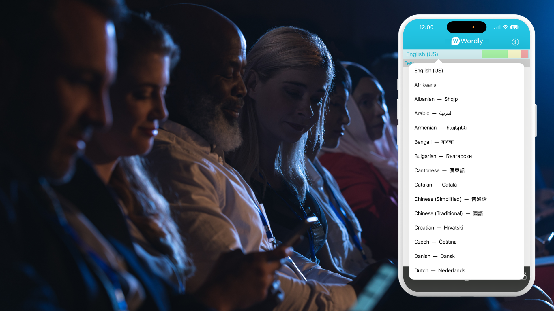 A diverse group of conference attendees sit in a dimly lit auditorium, each viewing their smartphones. One phone displays Wordly, showcasing real-time translation at events