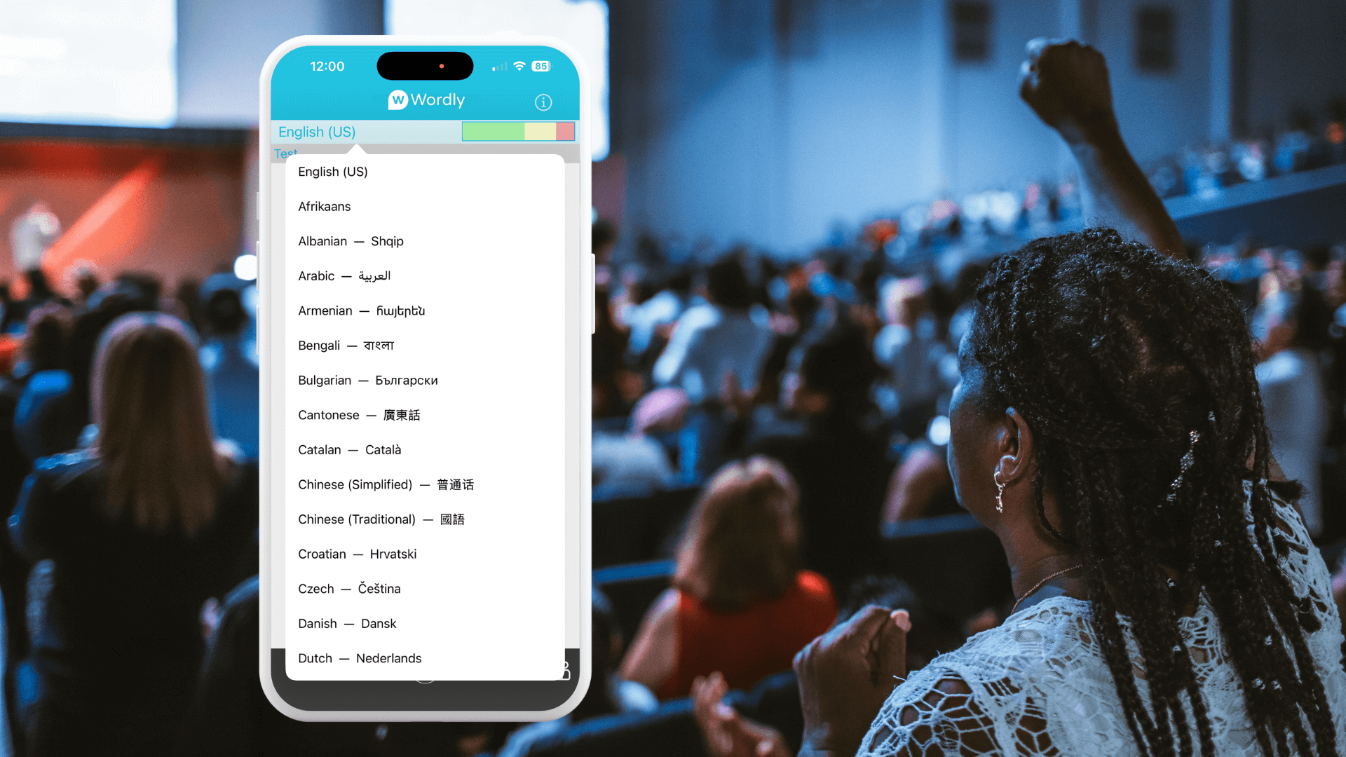 A woman raises her hand in worship inside a crowded church while a smartphone screen in the foreground displays Wordly showing a list of available translation languages