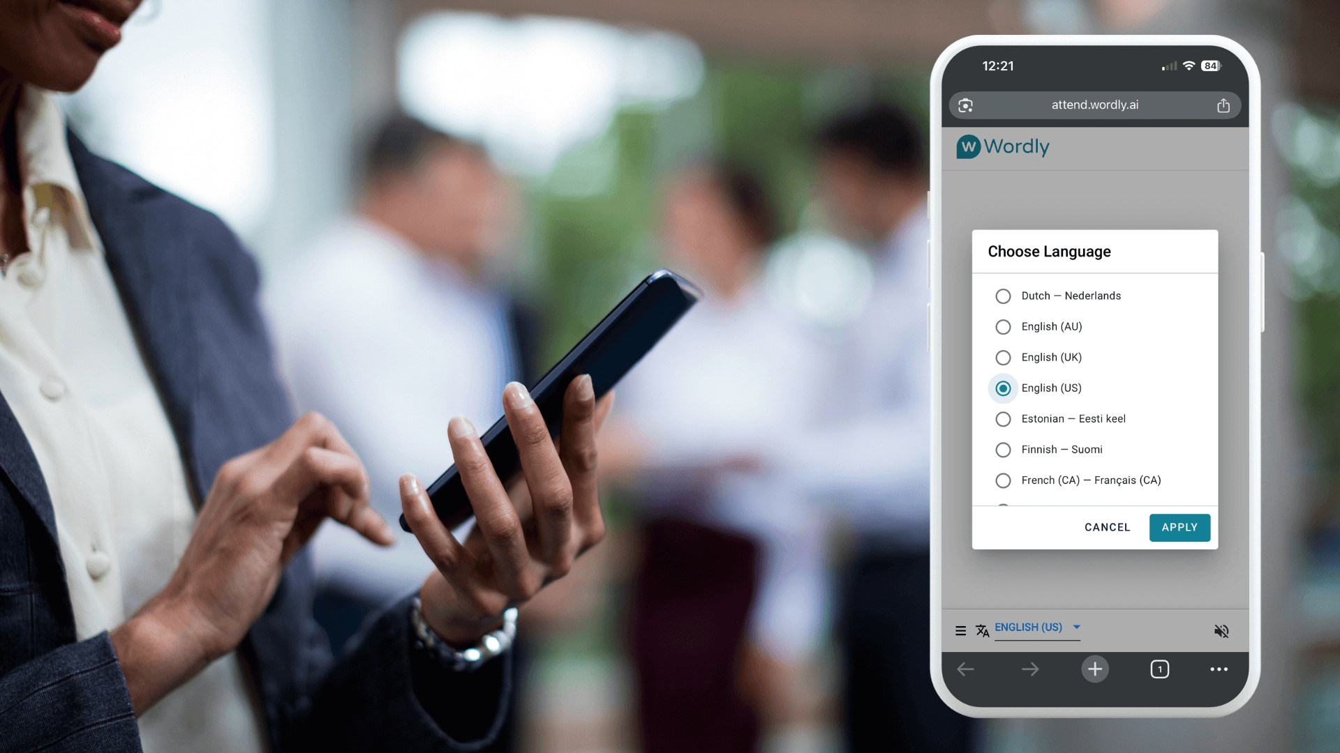 A legal professional selects their preferred language on a smartphone using Wordly, displaying real-time translation options during a meeting