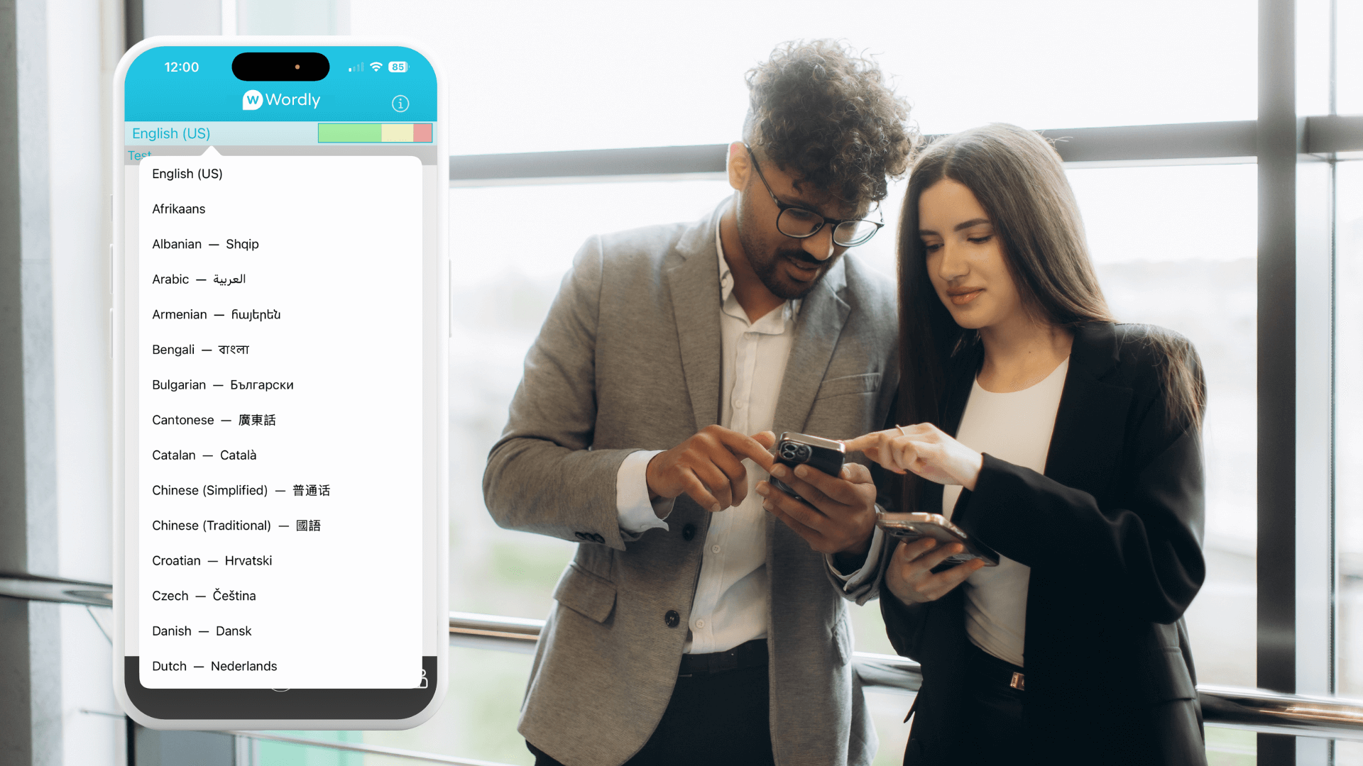 Two professionals review a mobile screen showing Wordly with a list of available languages, illustrating real-time multilingual accessibility