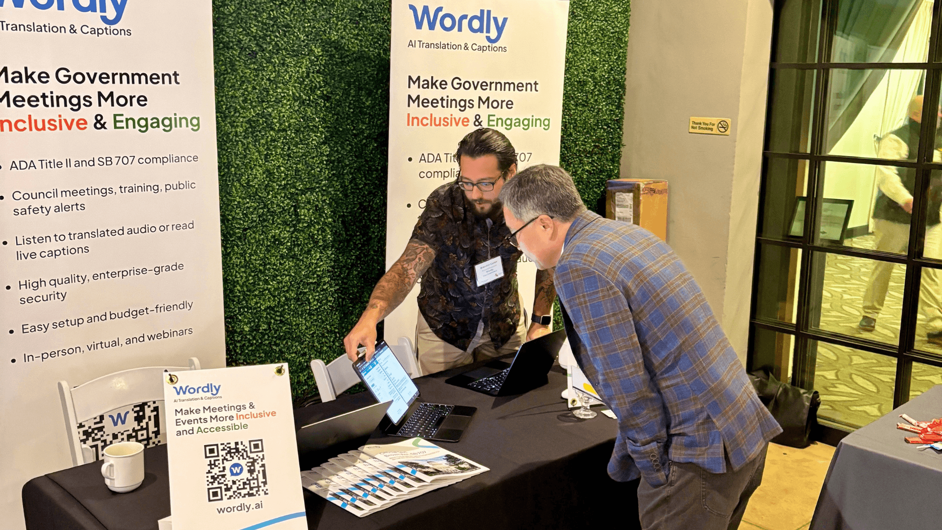 Wordly team exhibiting their AI translation platform at a government conference