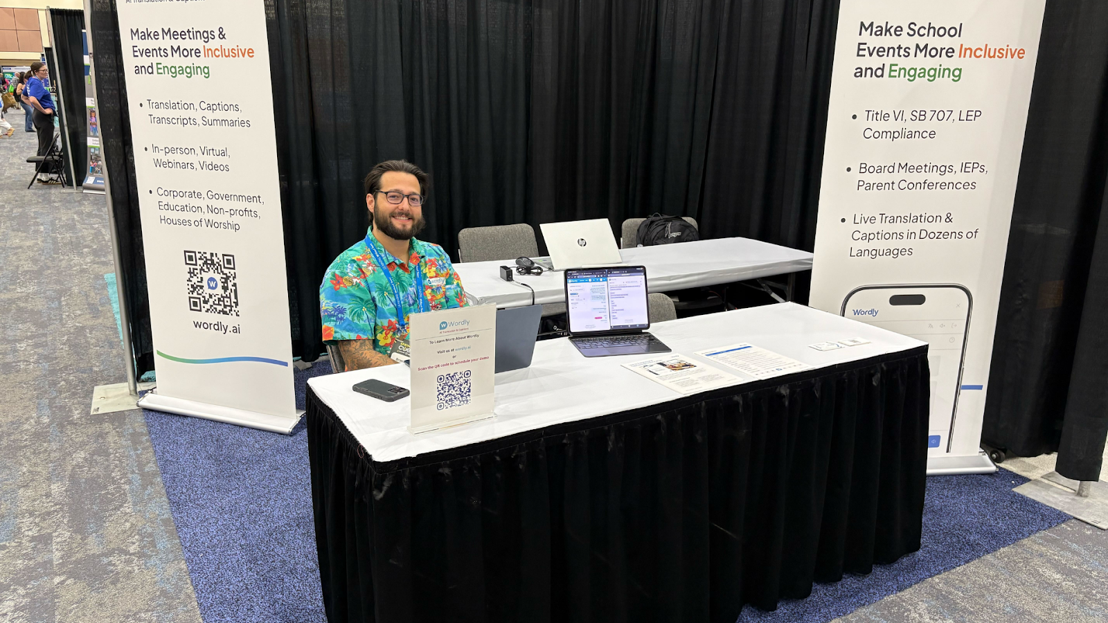 Wordly team exhibiting their AI translation platform at an education conference