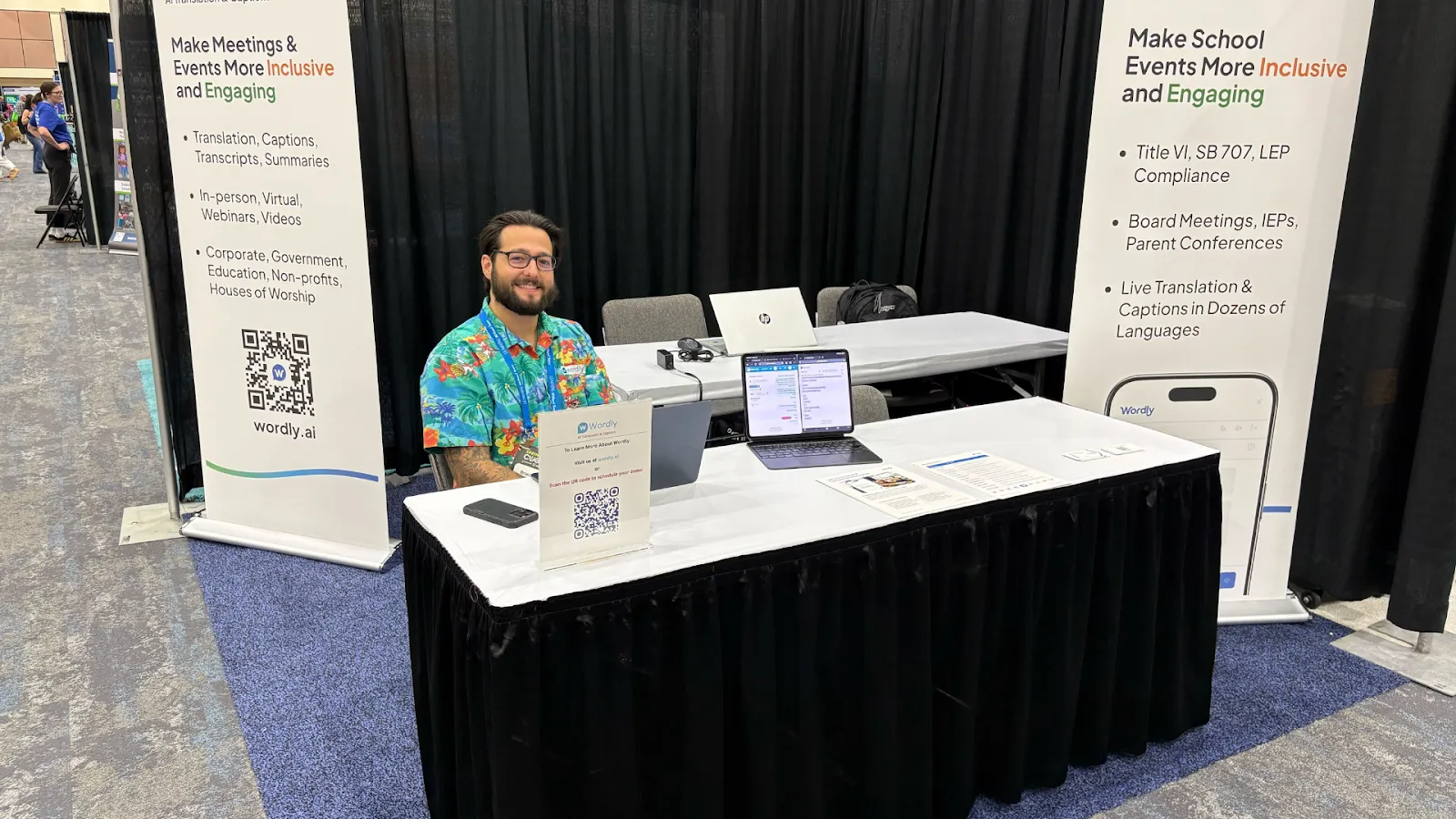 Wordly team exhibiting their AI translation platform at an education conference