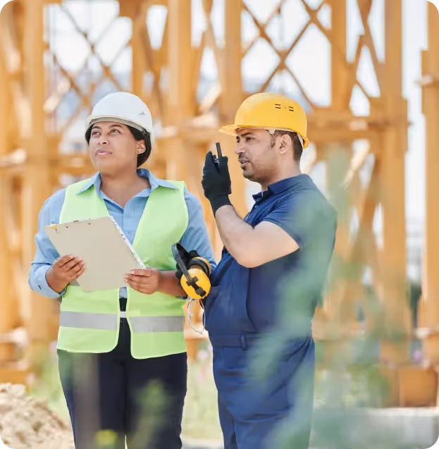 Construction crew reviewing plans on site