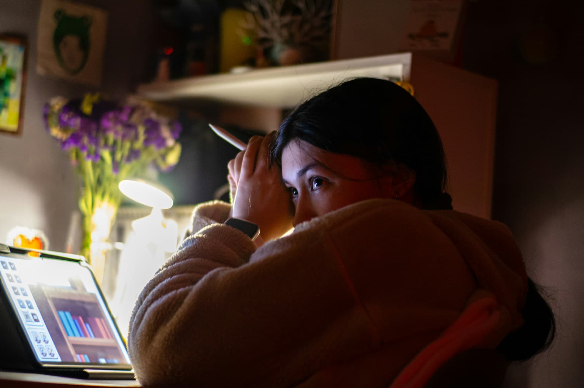 a-woman-sitting-in-front-of-a-laptop-computer