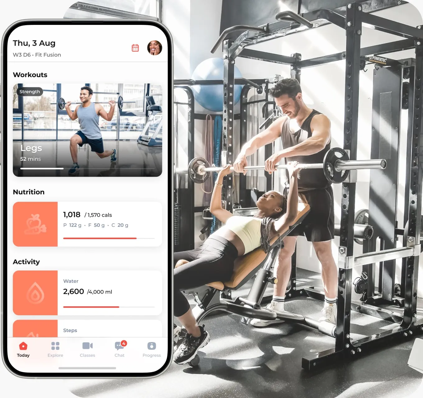 A woman bench presses weights with a trainer assisting her in a gym, next to a phone screen displaying a fitness app with workouts, nutrition, and activity tracking.