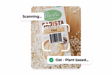 Barcode scanning on Pacific Foods Barista Series Oat Plant-Based Beverage carton surrounded by oats.