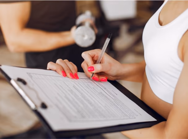 a sample showing fitness coach writing something