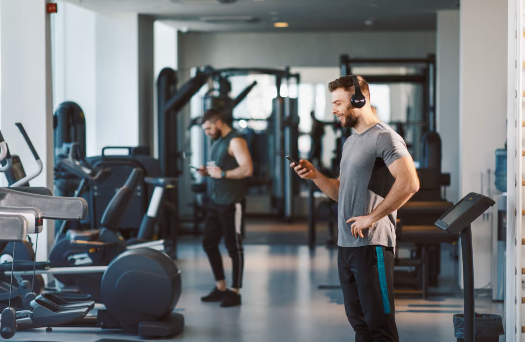 a fitness coach in gym wearing headphone
