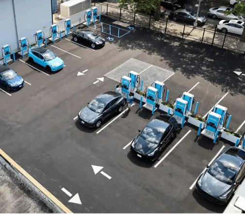 Aerial view of Revel vehicles at a charging hub