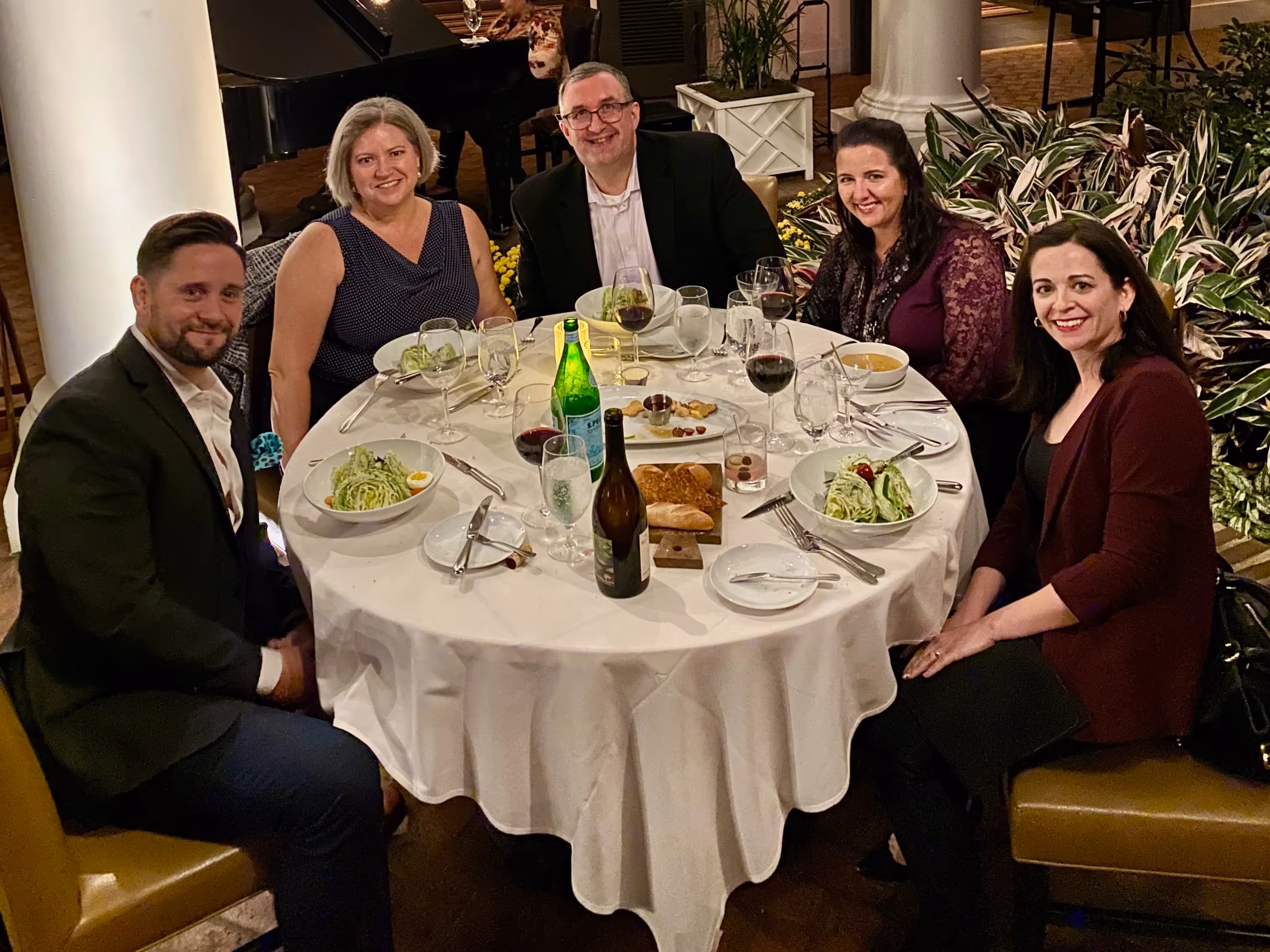 Photo of the Documate team and clients at a client dinner.