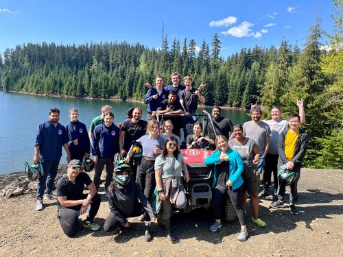 Group of employees smiling on a Zoom call