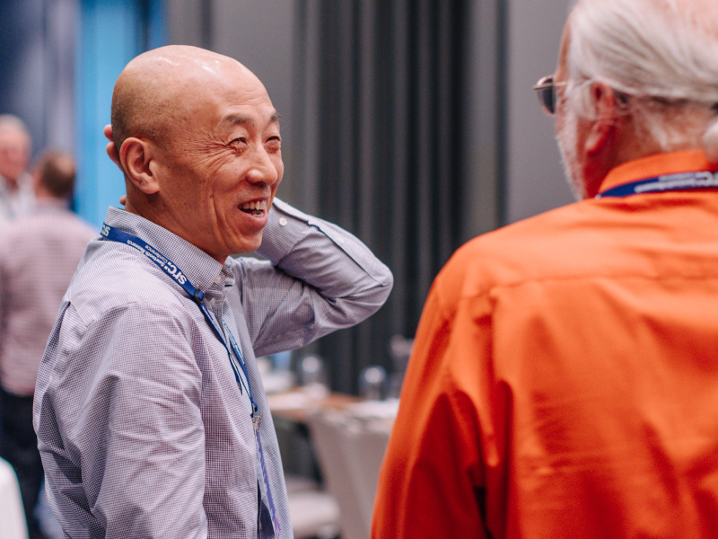 Two men engaged in conversation.