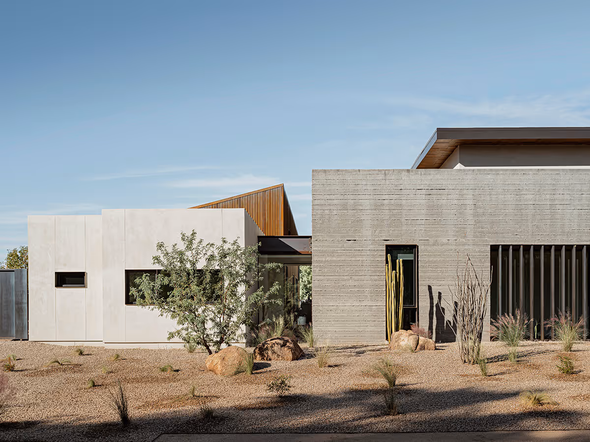 stucco, boardformed concrete and rusted corrugated metal modern desert house in Phoenix by The Ranch Mine