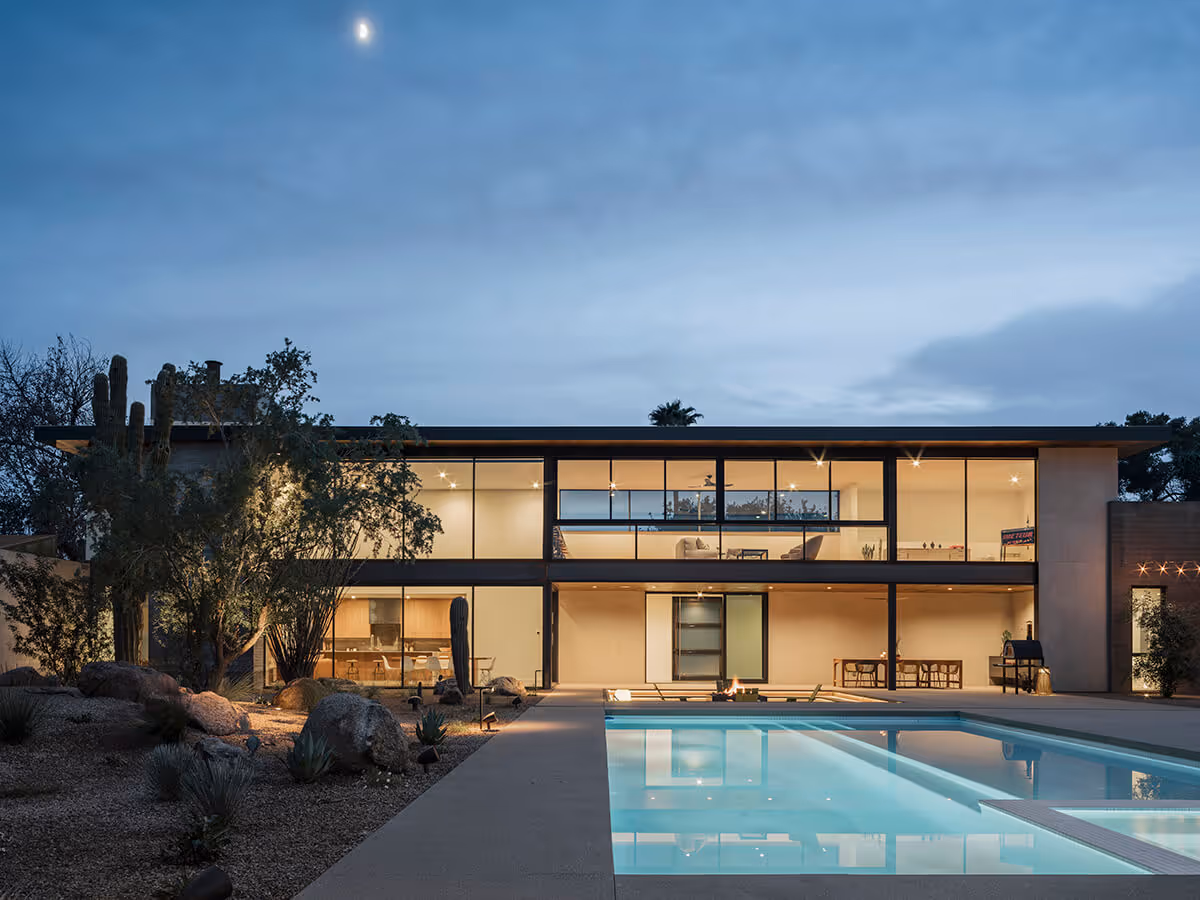nighttime view of pool at a modern desert house in Phoenix by The Ranch Mine