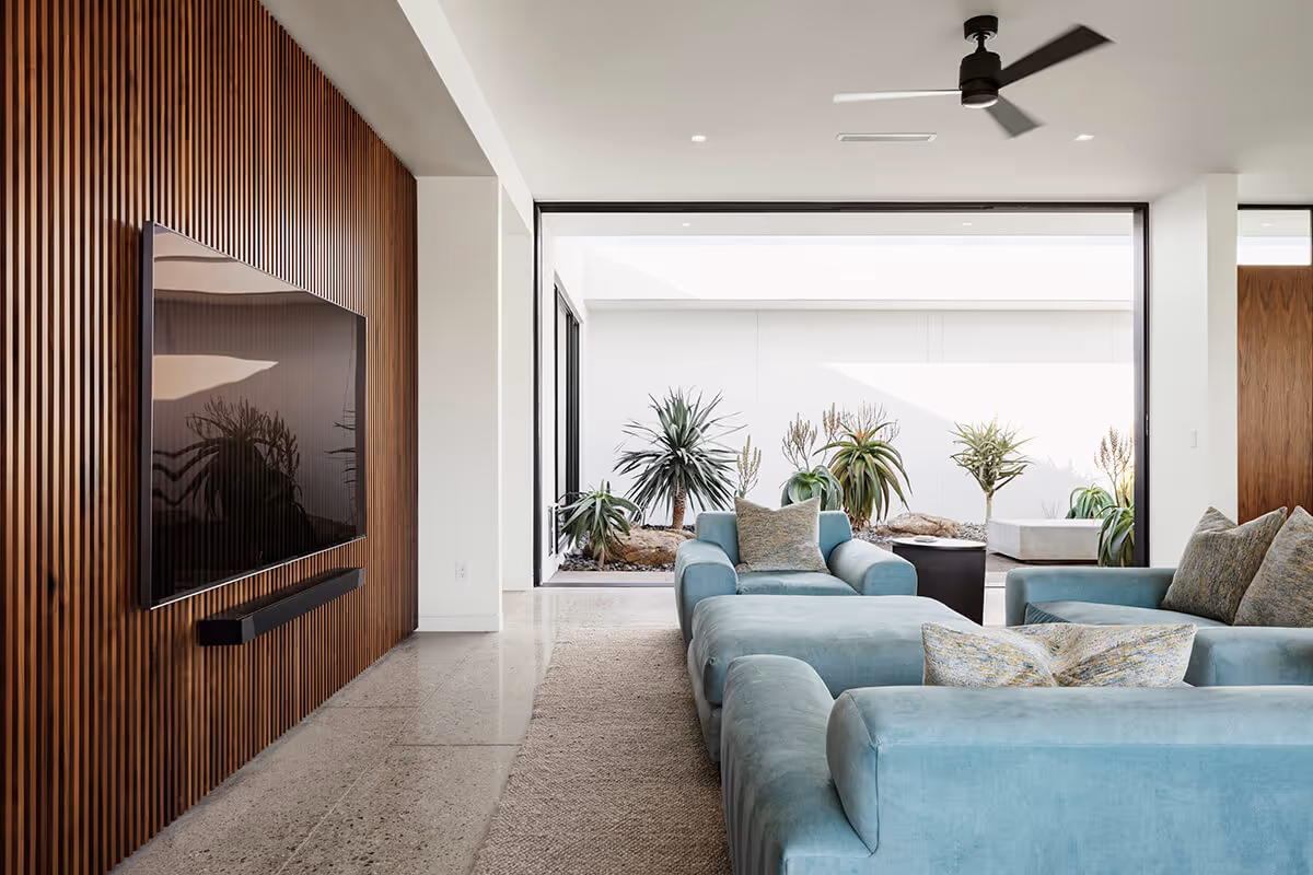 Living room towards courtyard of a modern desert house by The Ranch Mine