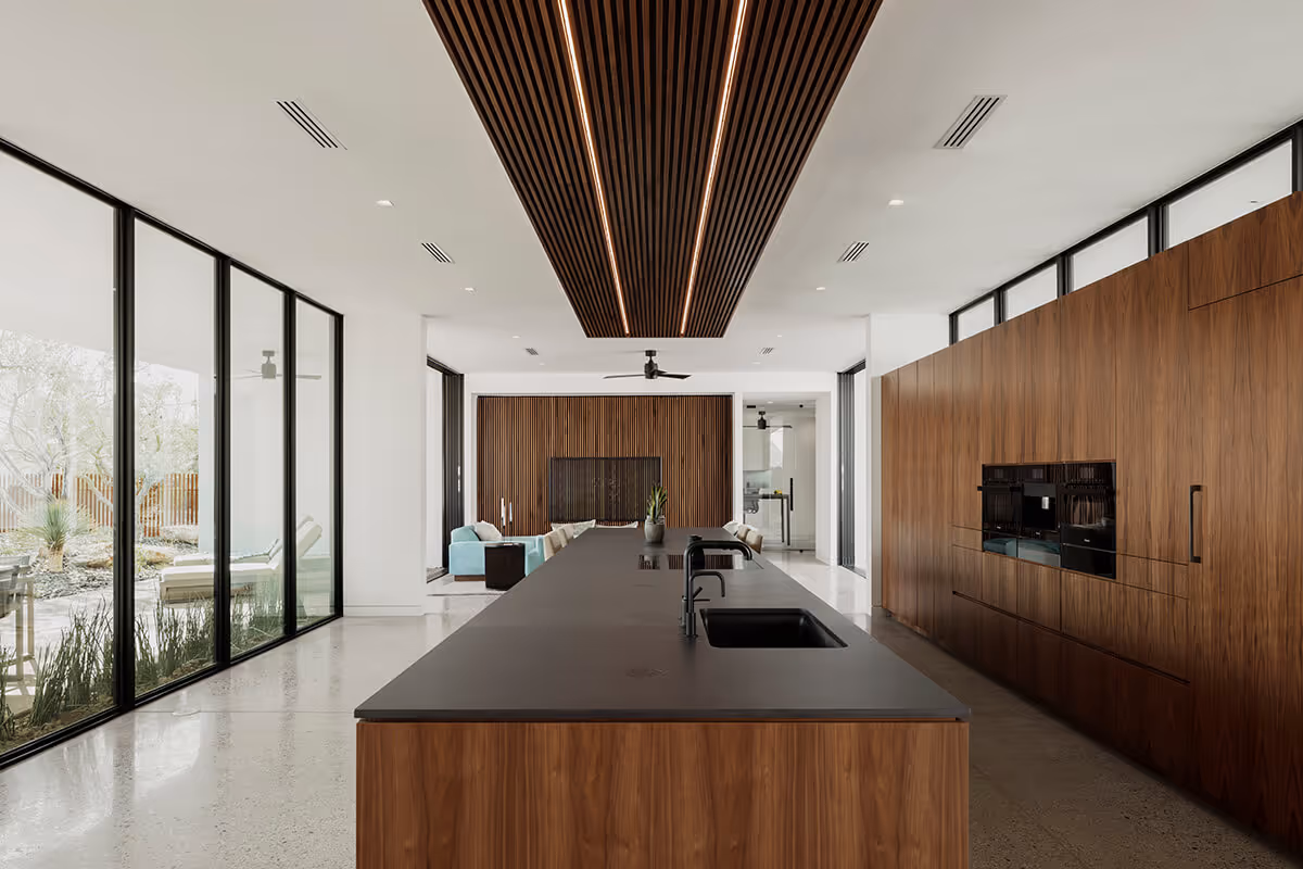 Walnut kitchen in a modern desert house by The Ranch Mine