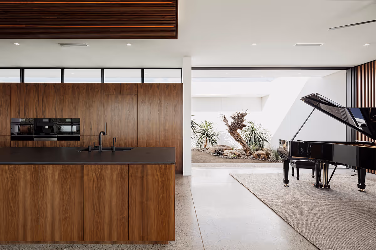 Walnut kitchen in a modern desert house by The Ranch Mine