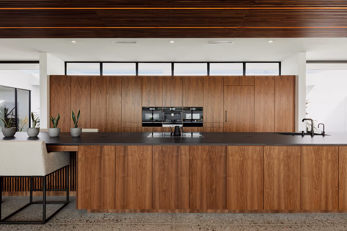Walnut kitchen in a modern desert house by The Ranch Mine