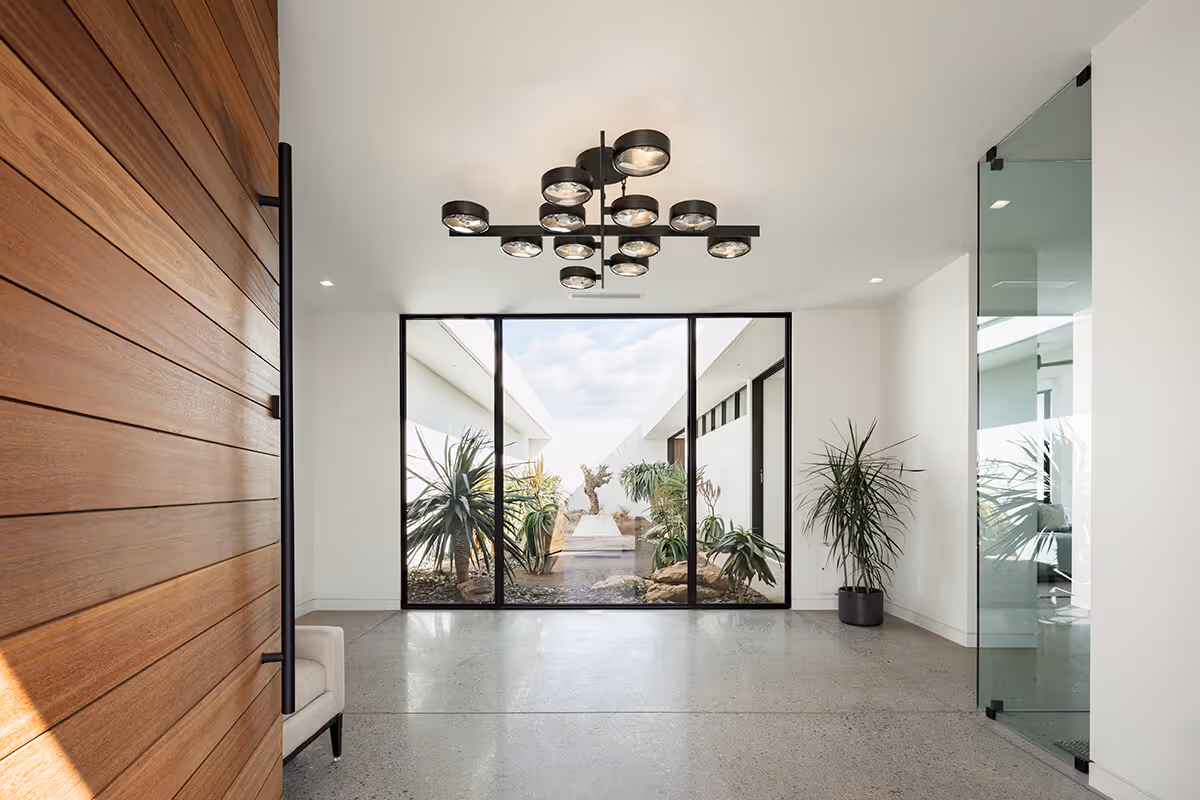 entry with view of courtyard of a modern desert house by The Ranch Mine