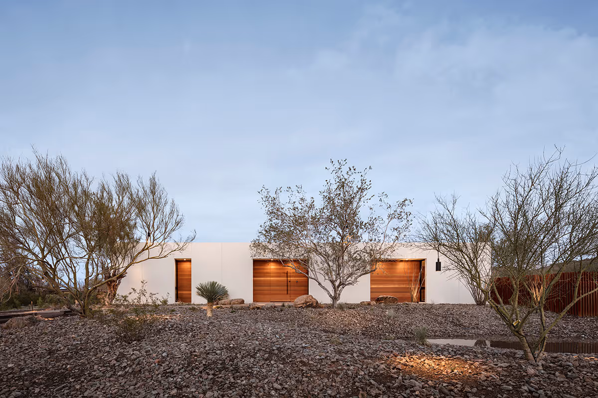 twilight exterior of a modern desert house by The Ranch Mine