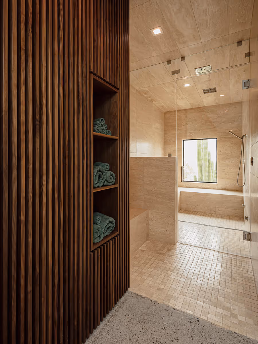 Steam shower with storage  in a modern desert home by The Ranch Mine