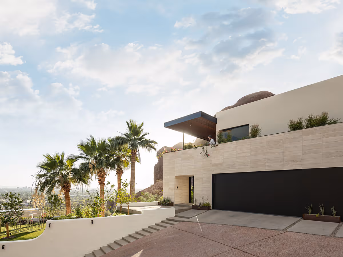 Garage of a home renovation and addition transforming a Spanish Colonial Revival house into a modern mountainside home in Phoenix by The Ranch Mine
