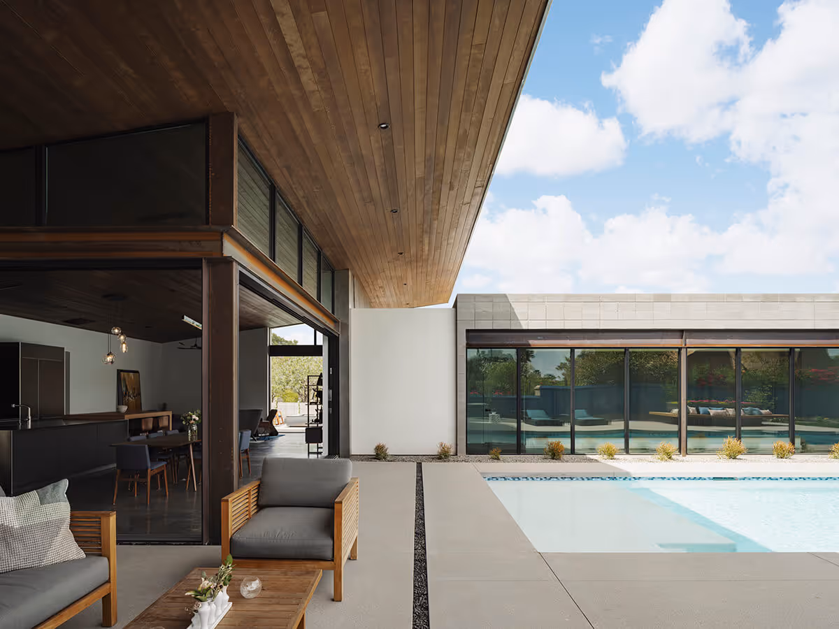 Wood ceiling overhang with pool at a modern home in Phoenix by The Ranch Mine