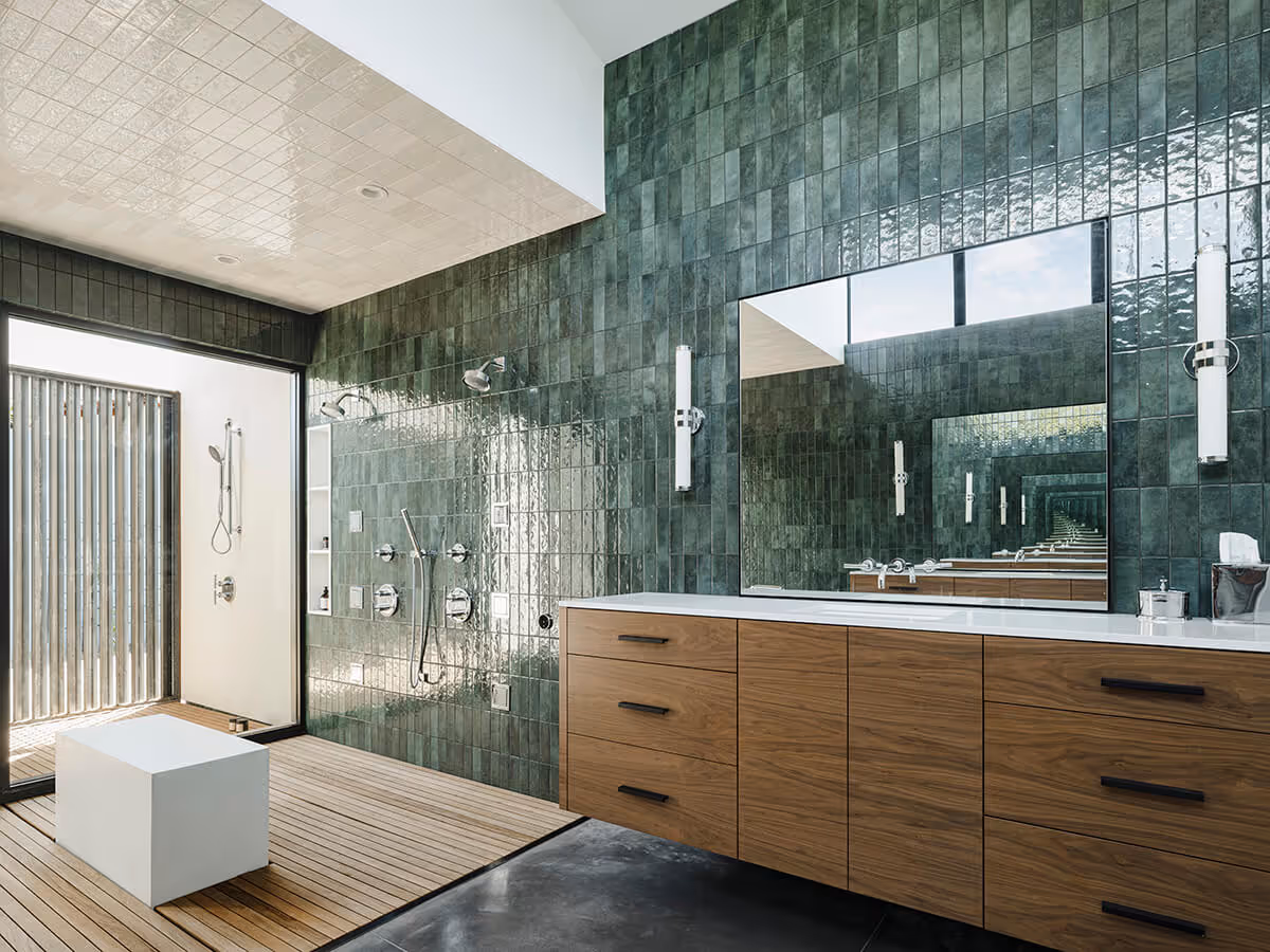 Wood vanity with green tile at a modern home in Phoenix by The Ranch Mine