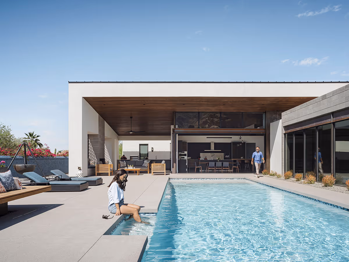 Pool with indoor outdoor living at a modern home in Phoenix by The Ranch Mine