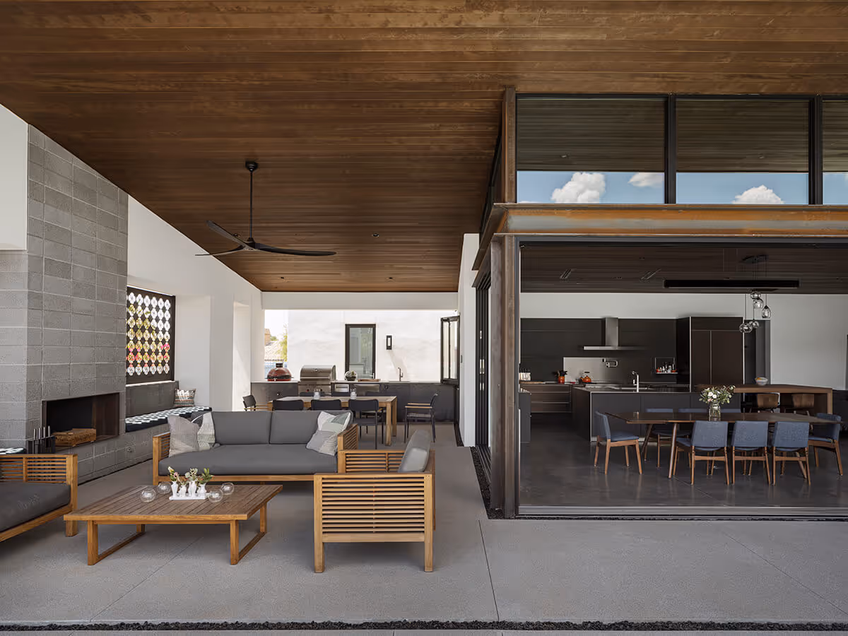 Indoor outdoor living with wood ceiling covered patio at a modern home in Phoenix by The Ranch Mine
