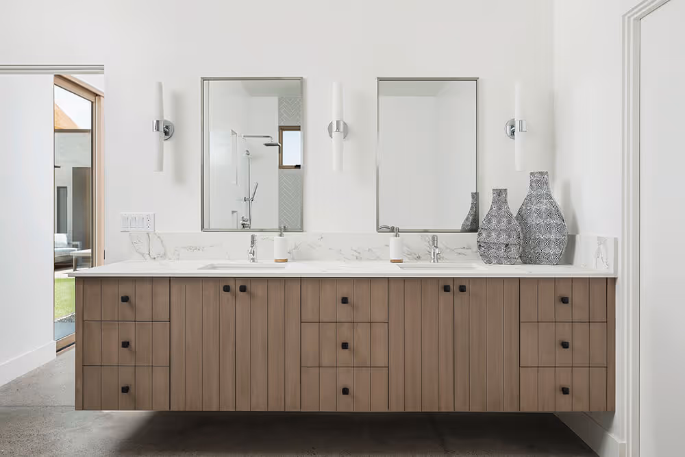 Grooved wood bathroom vanity at a southwest modern house by The Ranch Mine