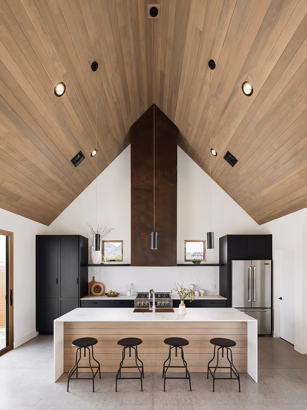 Kitchen with a wood ceiling at a southwest modern house by The Ranch Mine
