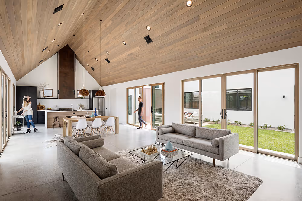 Great room with a wood ceiling at a southwest modern house by The Ranch Mine