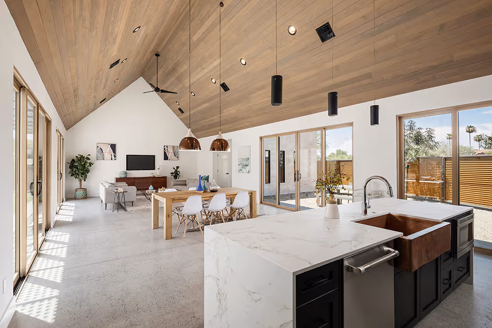 Great room with a wood ceiling at a southwest modern house by The Ranch Mine