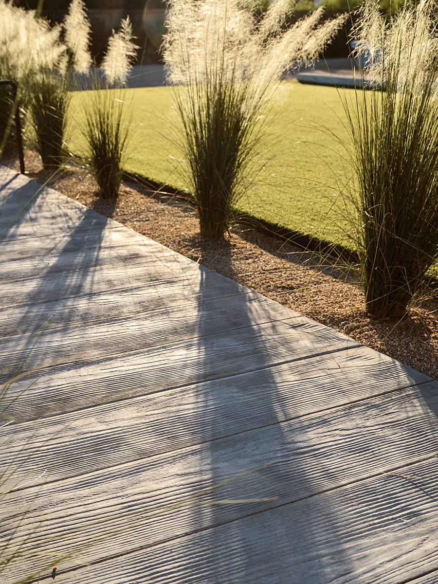 Boardstamped concrete walkway by The Ranch Mine