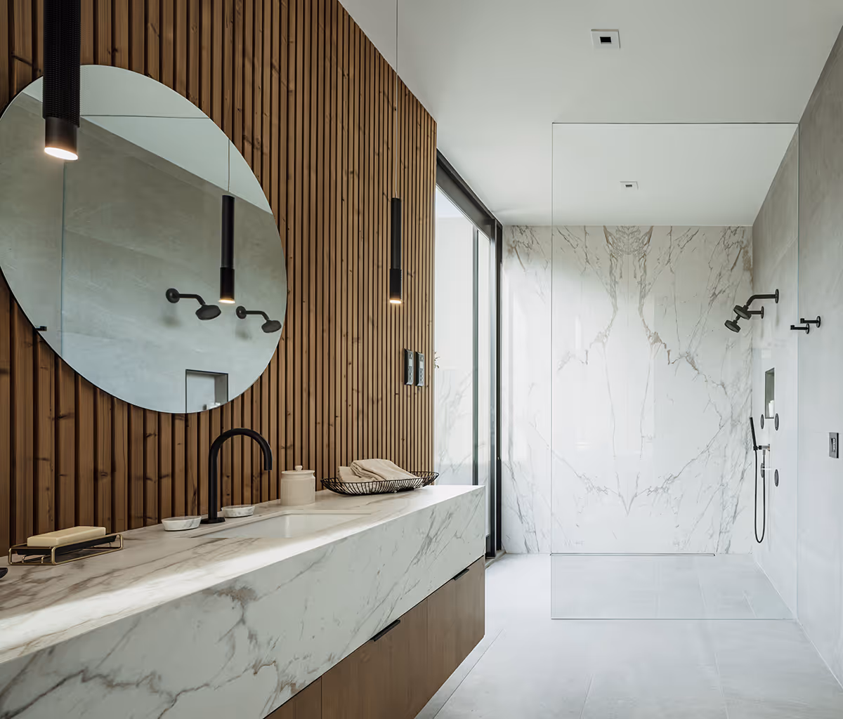 marble shower with lunawood detail at modern gable house in Paradise Valley Arizona by The Ranch Mine