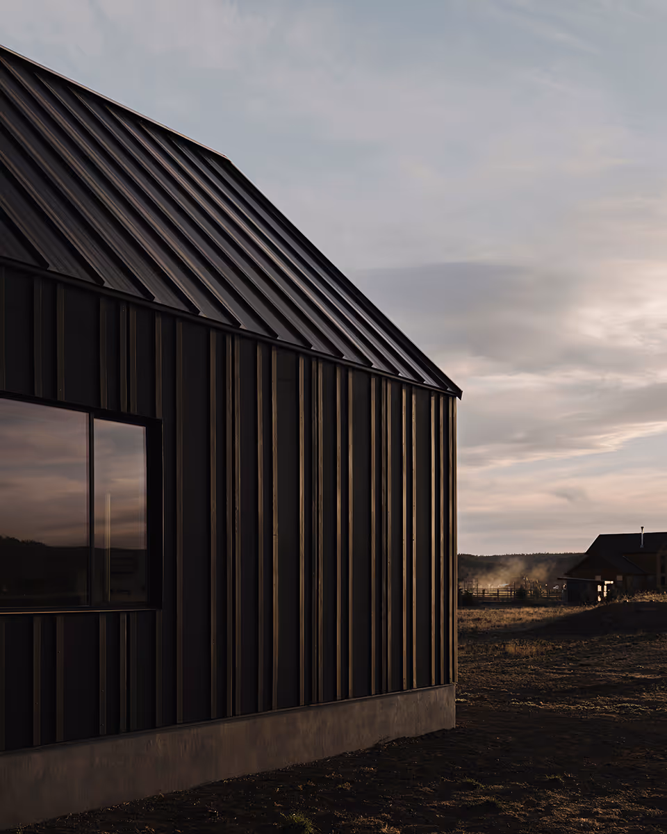 Modern Scandinavian black exterior house with gabled roofs in Flagstaff, Arizona by The Ranch Mine