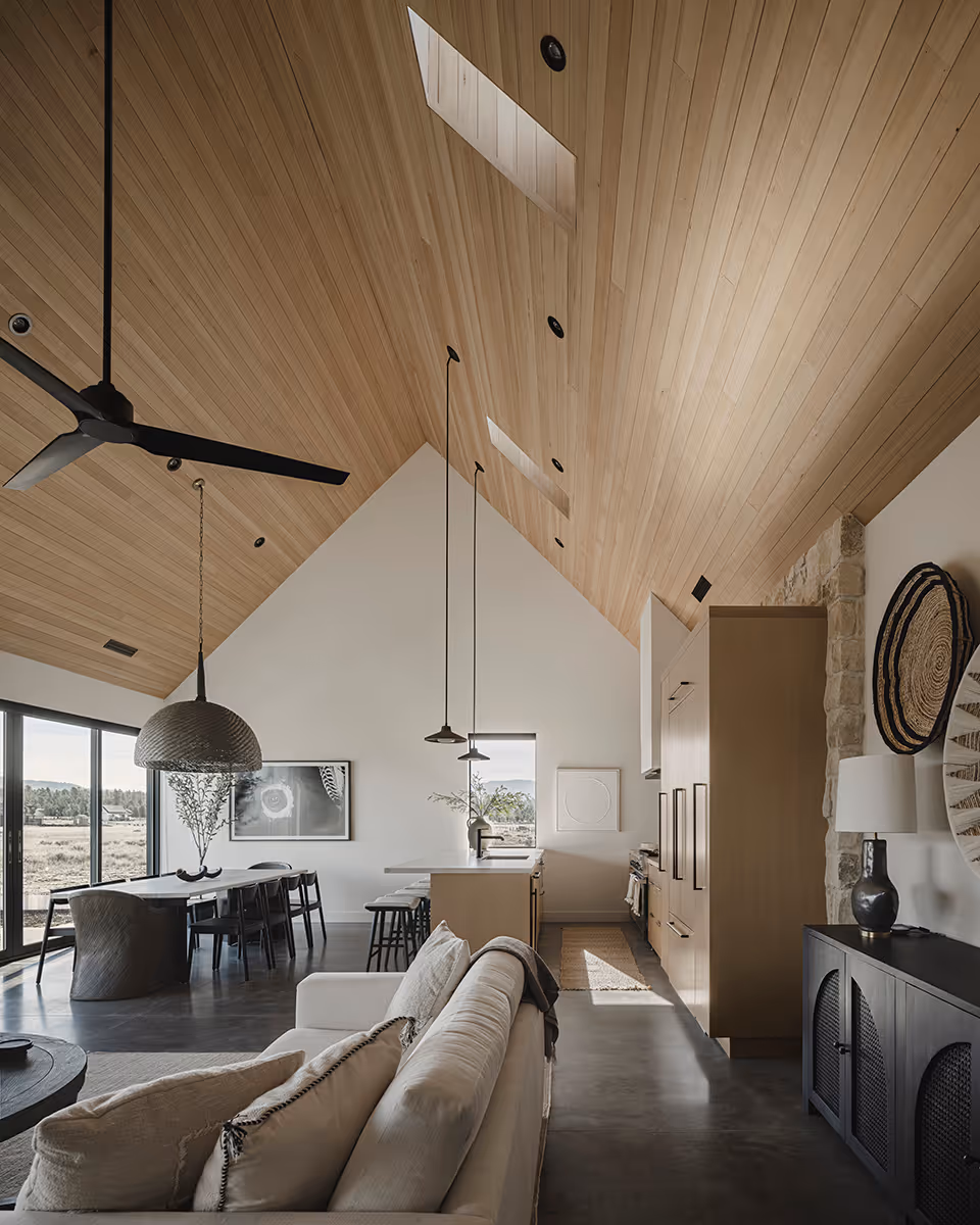 Great room with a vaulted wood ceiling at a modern Scandinavian house in Flagstaff, Arizona by The Ranch Mine